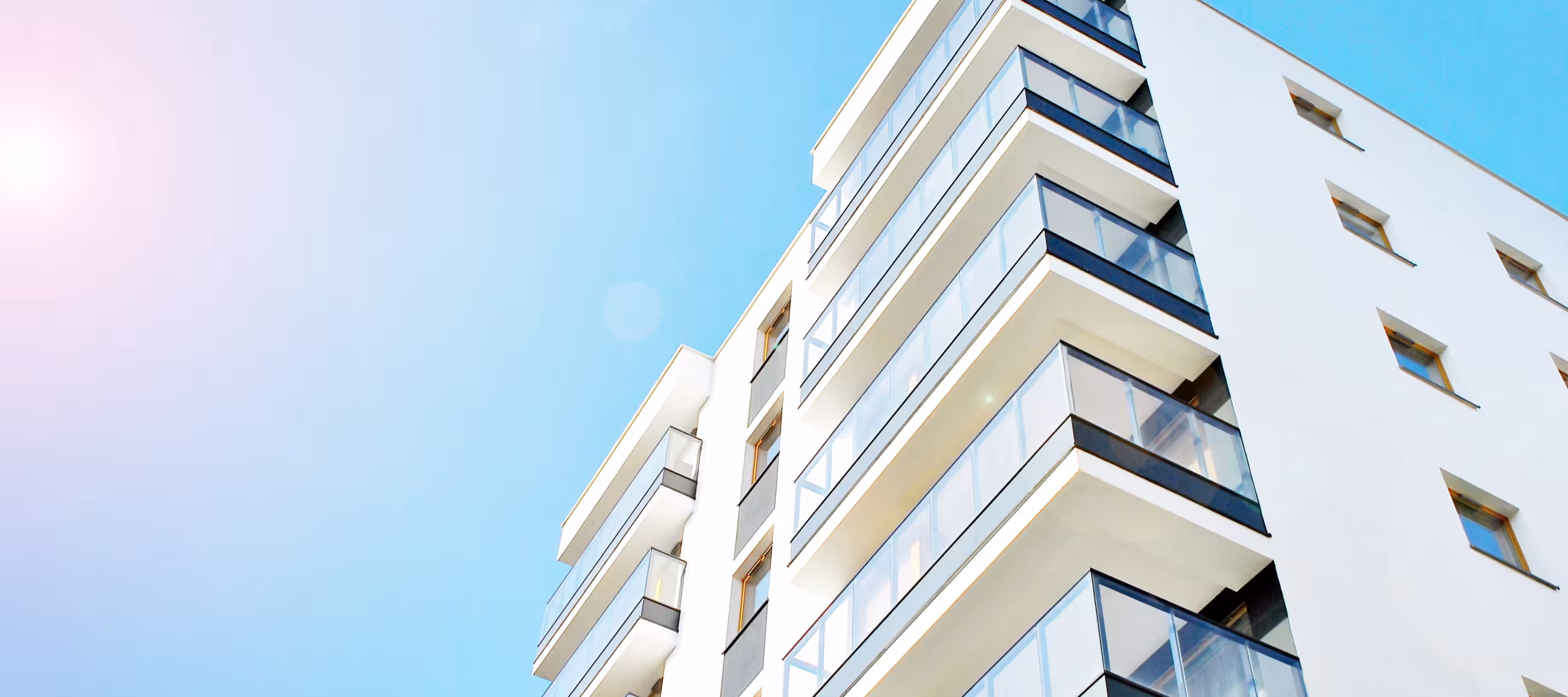 Ok, so this is an apartment building and it looks really nice against the blue sky