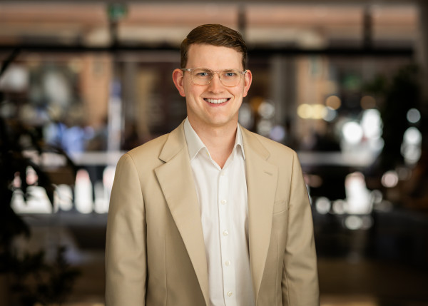 Connor's headshot for the website and he's smiling