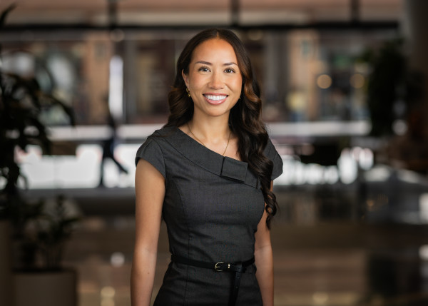 Shenaya standing in the lobby, posing for a staff headshot